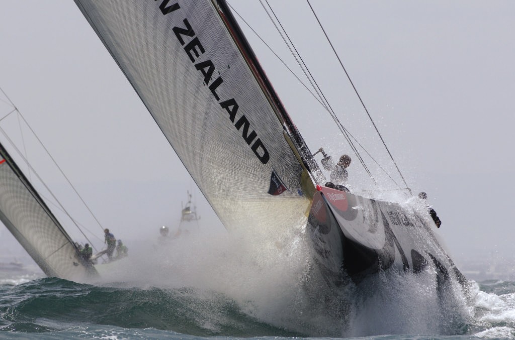 Emirates Team New Zealand NZL92 launches out of a large wave on approach to the first mark rounding in race seven of the Louis vuitton Cup semi final against Desafio Espanol ESP97 © Emirates Team New Zealand / Photo Chris Cameron ETNZ 