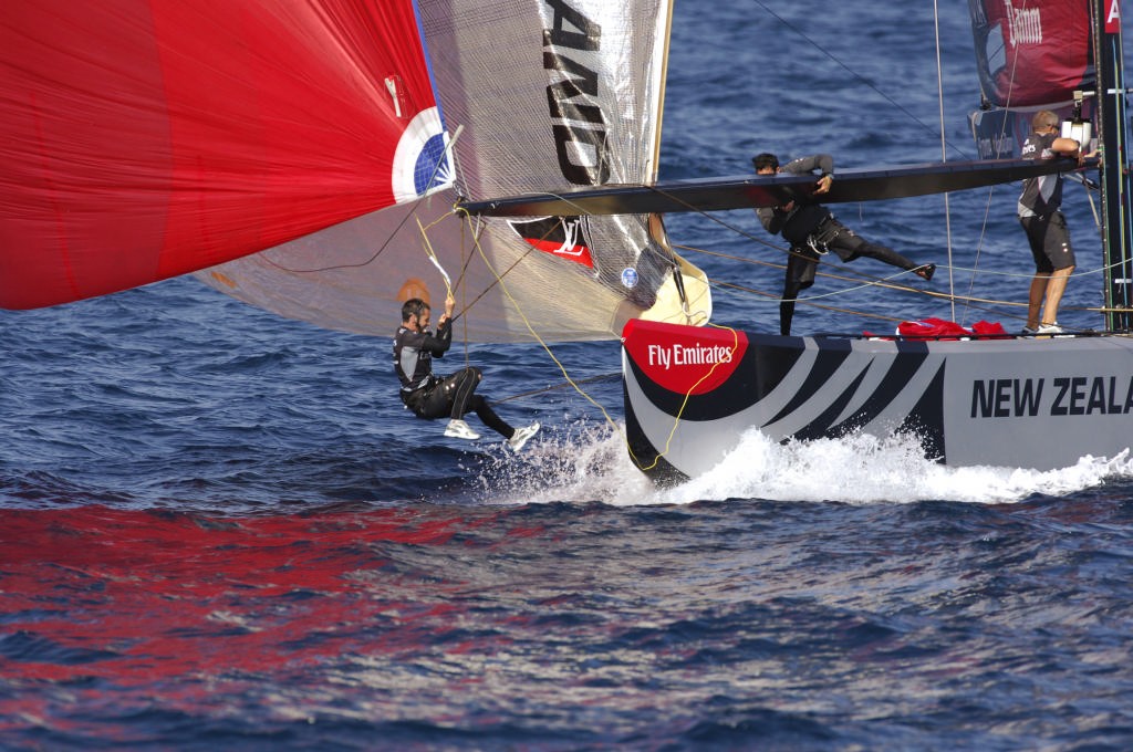 A few minutes later, Richard Meachem hits the water trying to make the best of a late tactical decision around the leeward mark aboard NZL-92, Race 3 America’s Cup © Emirates Team New Zealand / Photo Chris Cameron ETNZ 