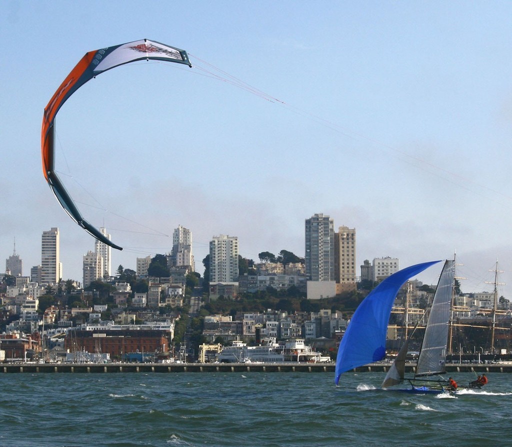 Local Natural Blues 18’ Skiff and a kite boarder fly past The City - 18’ Skiff International Regatta Day 4 San Francisco 2008 © Rich Roberts http://www.UnderTheSunPhotos.com