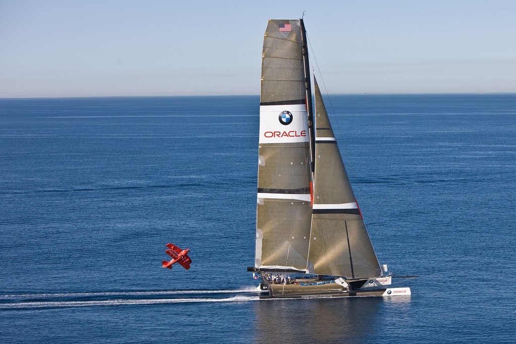 BMW ORACLE Racing - 90 ft trimaran meet Oracle Team high performance aerobatic plane © BMW Oracle Racing Photo Gilles Martin-Raget http://www.bmworacleracing.com