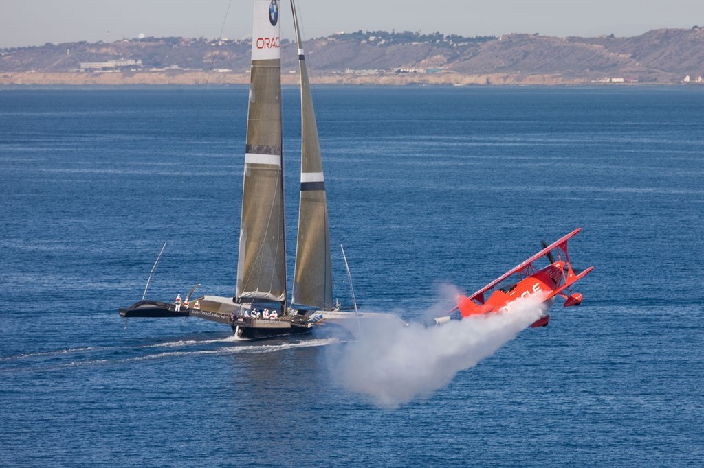 BMW ORACLE Racing - 90 ft trimaran meet  Oracle Team high performance aerobatic plane © BMW Oracle Racing Photo Gilles Martin-Raget http://www.bmworacleracing.com