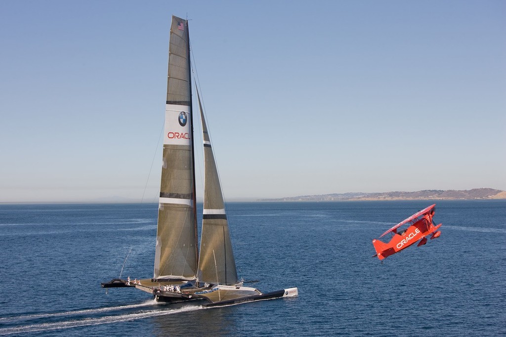 BMW ORACLE Racing - 90 ft trimaran meet  Oracle Team high performance aerobatic plane © BMW Oracle Racing Photo Gilles Martin-Raget http://www.bmworacleracing.com