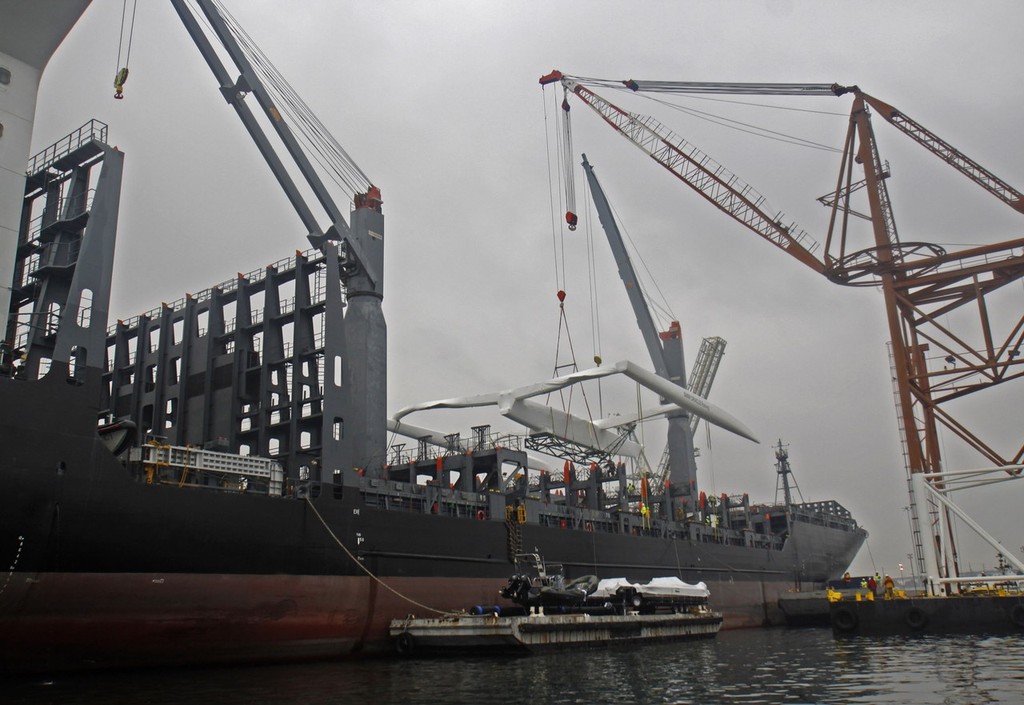 BMW Oracle Racing crew pack up the base in San Diego and the huge trimaran BOR90 is lifted by the giant RESTATE crane and slowly moved from the base to the Oceanlady freighter at the 10th street terminal to be place on the ship for the trip to Valencia, Spain.  Photo BMWOracle Racing/Bob Grieser © Bob Greiser/BMWOracle Racing www.bmworacleracing.com
