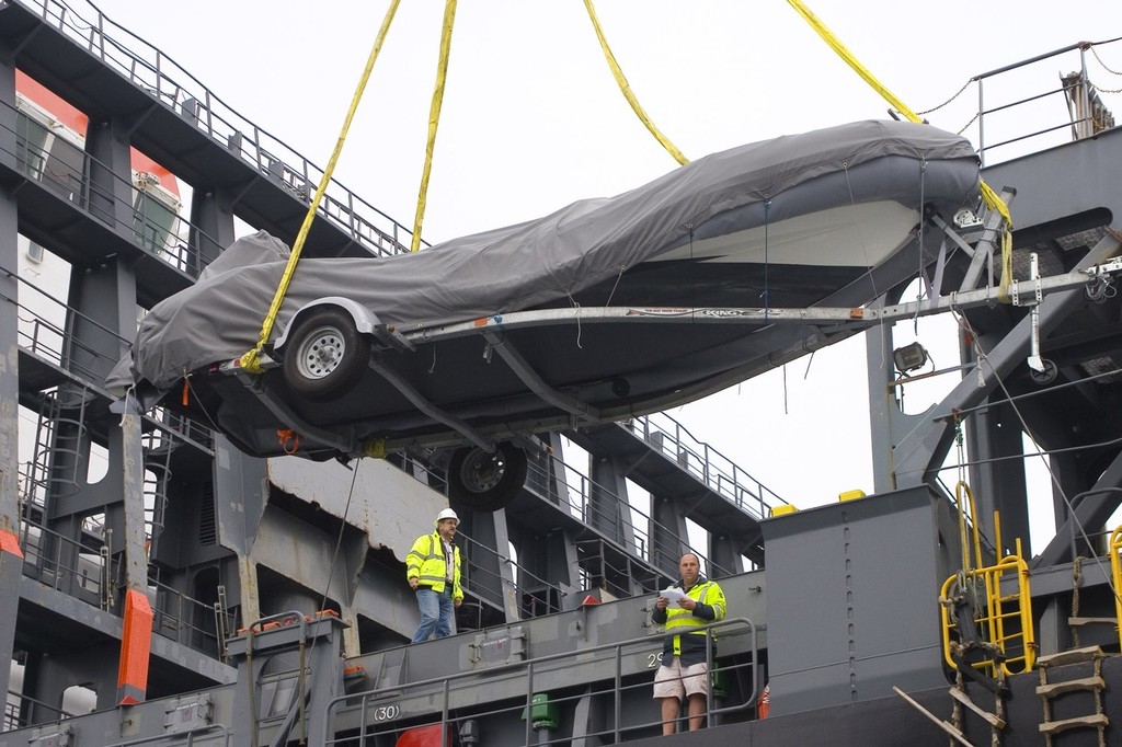 BMW Oracle Racing crew pack up the base in San Diego and the huge trimaran BOR90 is lifted by the giant RESTATE crane and slowly moved from the base to the Oceanlady freighter at the 10th street terminal to be place on the ship for the trip to Valencia, Spain.  Photo BMWOracle Racing/Bob Grieser © Bob Greiser/BMWOracle Racing www.bmworacleracing.com