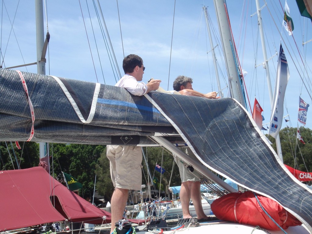 Crew of Next working on the main sail on Christmas Eve  © Wai Lee