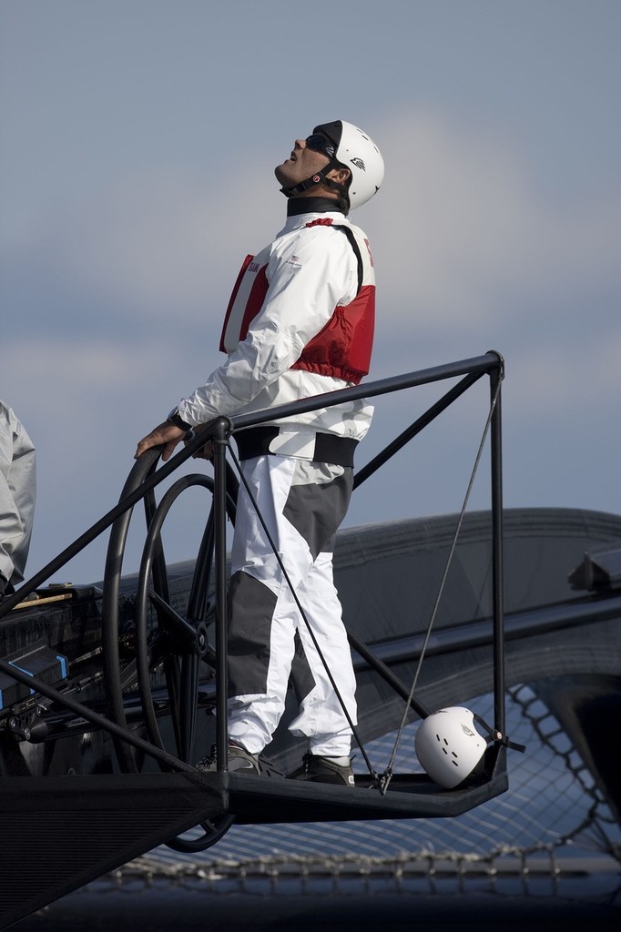 BMW Oracle Racing helmsman all kitted out in the cross beam helm position. © BMW Oracle Racing Photo Gilles Martin-Raget http://www.bmworacleracing.com
