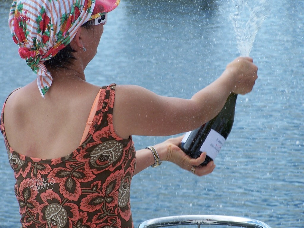 Lanying Brouwer christens Santorini with the traditional champagne. - Riviera Syndication launch party © Wayne Woodward