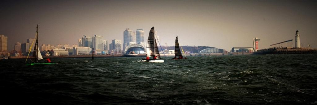 Wetas sailing with the backdrop of Qingdao Olympic Marina - Qingdao Weta Sailing - 2009 Autumn Regatta  © SailWeta Jeppe Mortensen