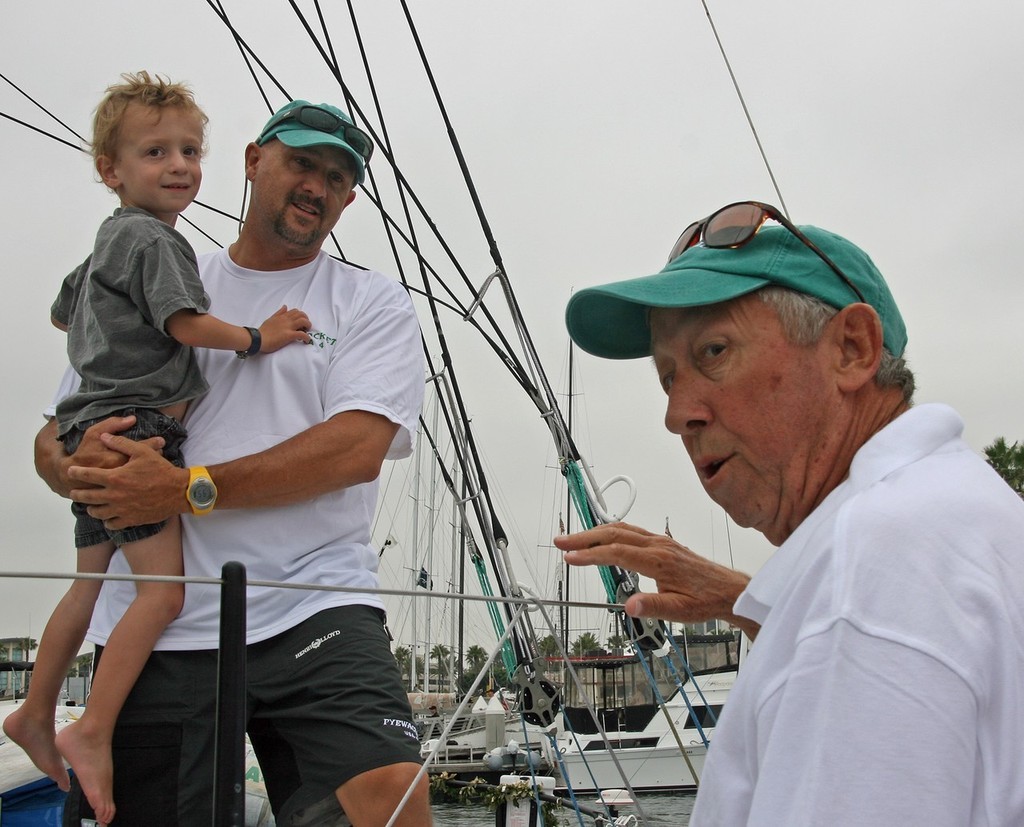 Roy E. Disney (r.) turned Pyewacket over to son Roy Pat, holding grandson Aidan - Transpac 2007 © Rich Roberts http://www.UnderTheSunPhotos.com