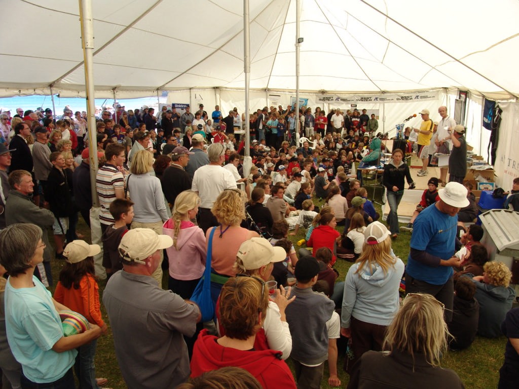 It is hard to do justice to the size of the 2006 Sir Peter Blake Torbay Regatta, however maybe this shot from inside the Big Top on the foreshore at Torbay goes some of the way - remember there are as many people outside the tent as in it! © Richard Gladwell www.photosport.co.nz