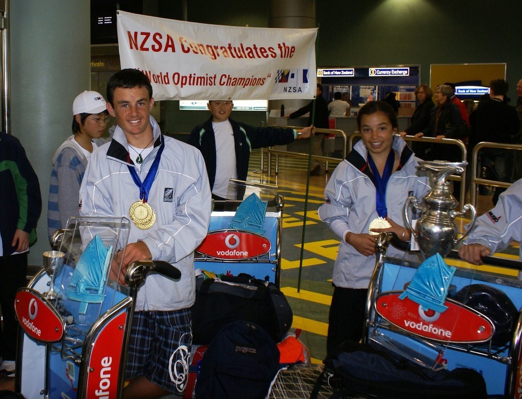 Open World Champion, Chris Steele and Alexandra Maloney, Girls World Champion and Open Bronze Medalist at Auckland Airport - Optimist return Home - August 2007 © Richard Gladwell www.photosport.co.nz