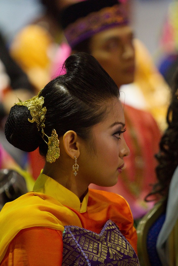 traditional Malaysian dancer group DBI wait to  preforms during the Monsoon Cup 2009. Kuala Terengganu, Malaysia. 28 November 2009. Photo: Brendon O’Hagan/Subzero Images © Gareth Cooke Subzero Images/Monsoon Cup http://www.monsooncup.com.my