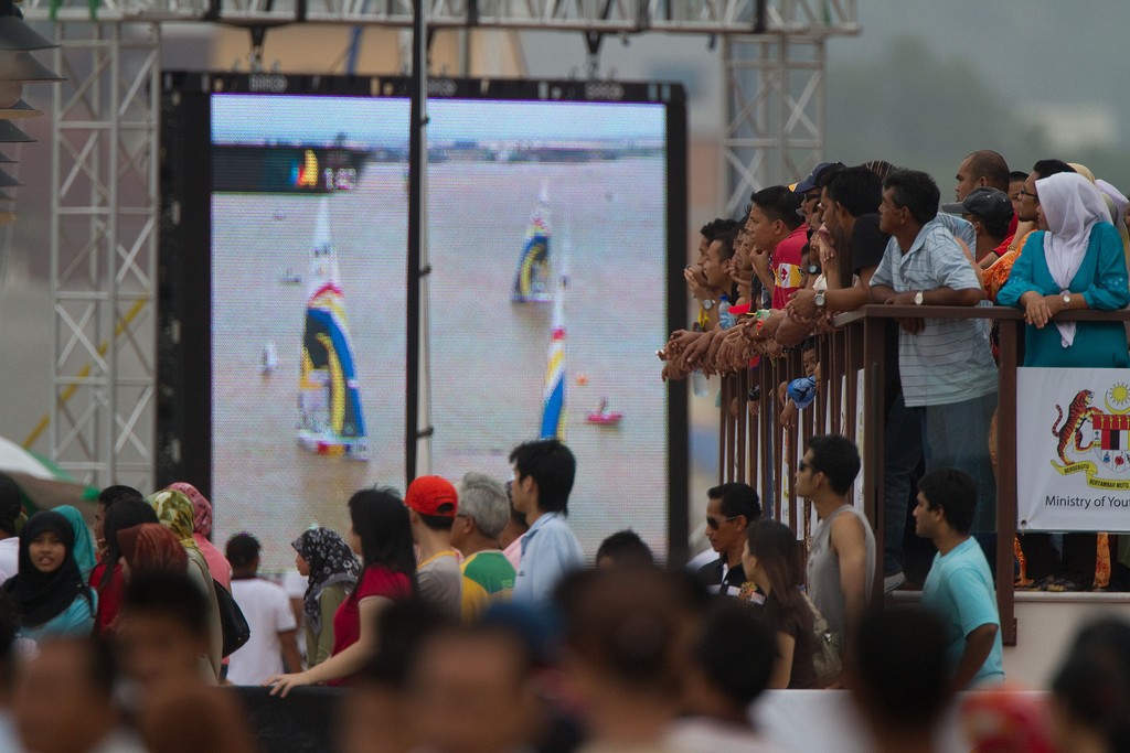  Crowds watch the Monsoon Cup on the water as well as the large screen  2009. Kuala Terengganu, Malaysia. 4 December 2009. Photo: Brendon O’Hagan/Subzero  © Gareth Cooke Subzero Images/Monsoon Cup http://www.monsooncup.com.my