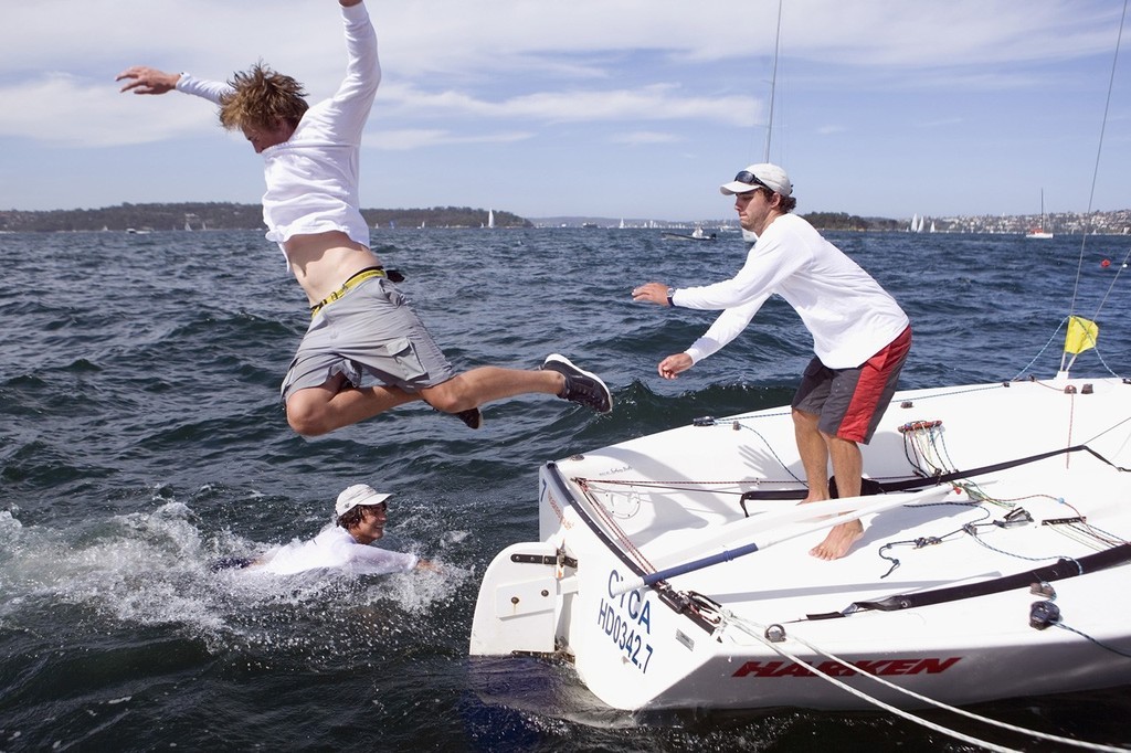 The winning team take a victory swim, Will MacKenzie is in the water, Kyle Langford is mid flight and Jamie Woods is on the Elliott 6. Photo:Andrea Francolini/Bavaria Yachts  - 2007 Bavaria Yachts International Youth Match Racing Regatta ©  Andrea Francolini Photography http://www.afrancolini.com/