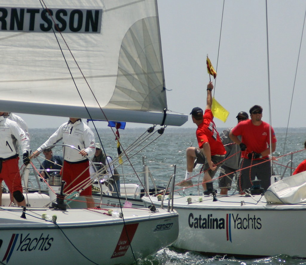 Scott Dickson&rsquo;s tactician, Tony Stuart, waves protest flag against Johnie Berntsson - 2007 Congressional Cup photo copyright Rich Roberts http://www.UnderTheSunPhotos.com taken at  and featuring the  class