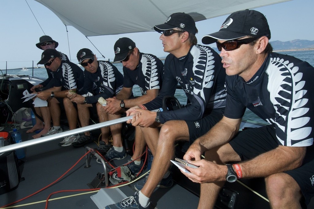 Emirates Team New Zealand NZL380, Adam Beashal discusses the upcoming coastal race on the way out to the start on  day three, Sardinia Trophy, Audi MedCup 23/7/2009 © Emirates Team New Zealand / Photo Chris Cameron ETNZ 