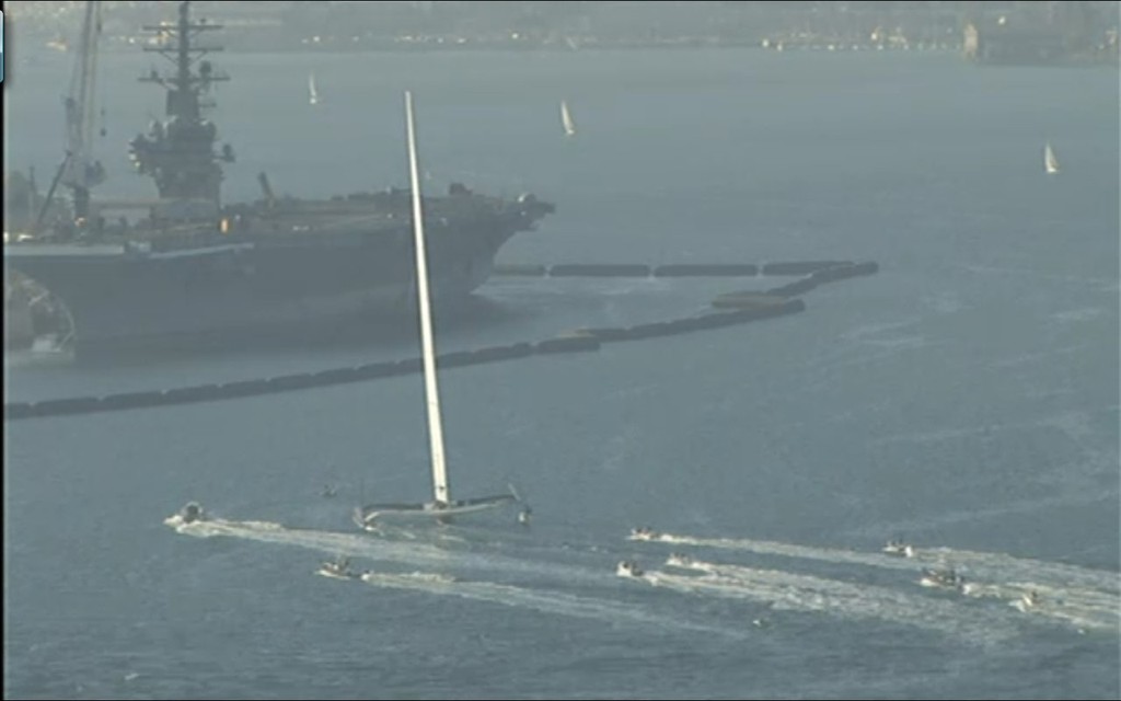 BOR90 with an aircraft carrier in the back ground, in San Diego Bay © Fox 5 www.fox5sandiego.com