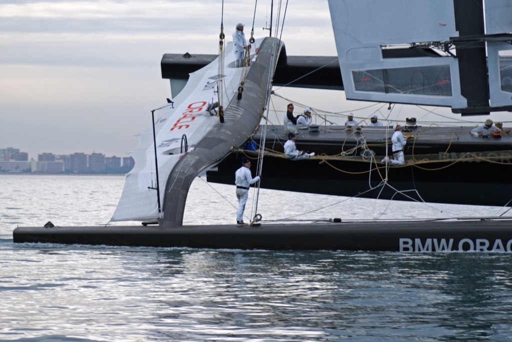 Russell Coutts checks out the view to leeward while sailing at 22kts with Larry Ellison on the helm during Practice Day, 2010 America’s Cup photo copyright Richard Gladwell www.photosport.co.nz taken at  and featuring the  class