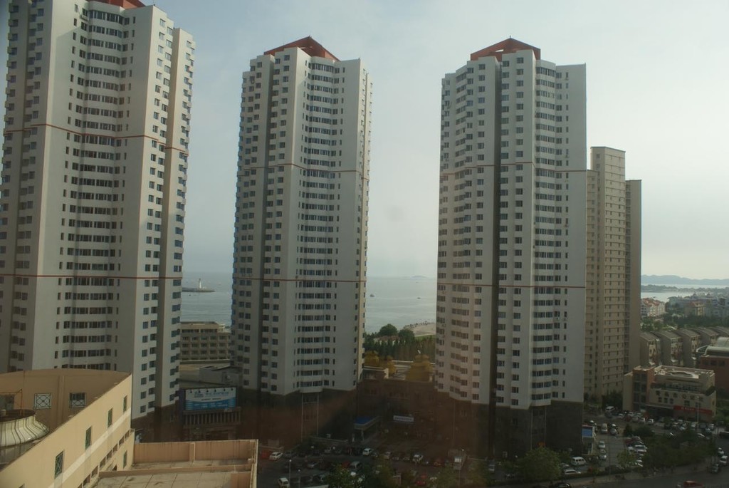 View from behind of the large towers that dot the Qingdao and surrounding coastal skyline. © Richard Gladwell www.photosport.co.nz