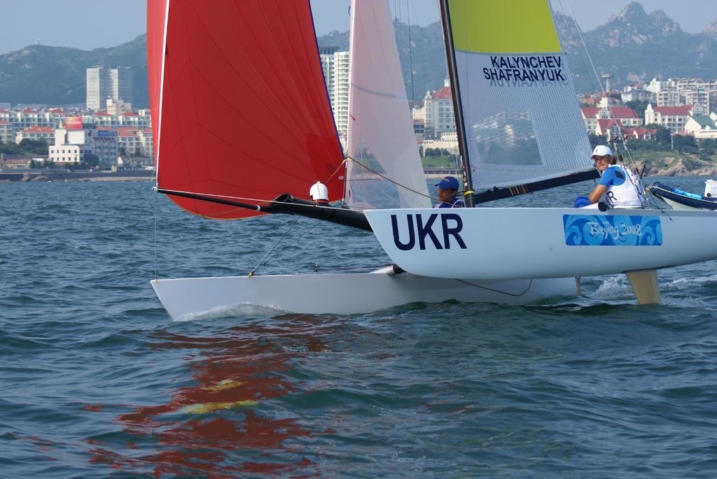 A regular Tornado sailing downwind off Qingdao, note the white camera mounted on the spinnaker snuffer - used for television coverage of the regatta. © Richard Gladwell www.photosport.co.nz