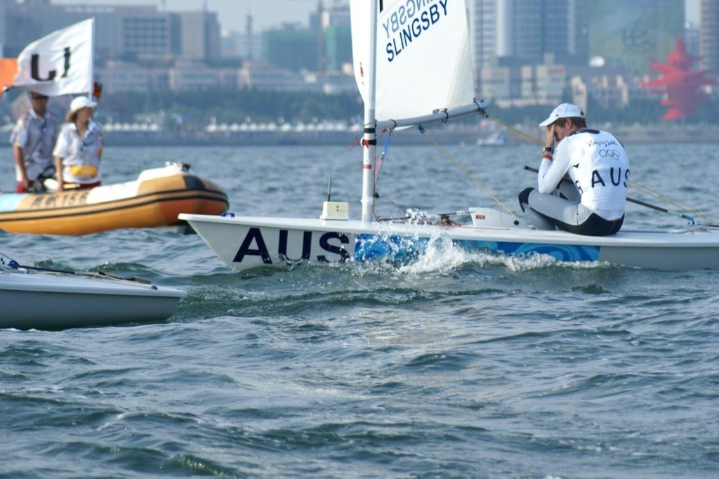 First time Olympic Learnings - Tom Slingsby, head in hands, just metres from the finish line of race 2 in the Mens Laser © Richard Gladwell www.photosport.co.nz