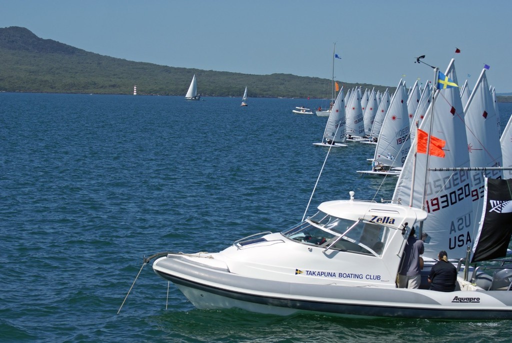 Zac's sister, Paige Railey squeezes past the Committee Boat on Day 3 of the 2008 Womens Laser Radial Worlds at Takapuna incurring a RRS42 penalty © Richard Gladwell www.photosport.co.nz