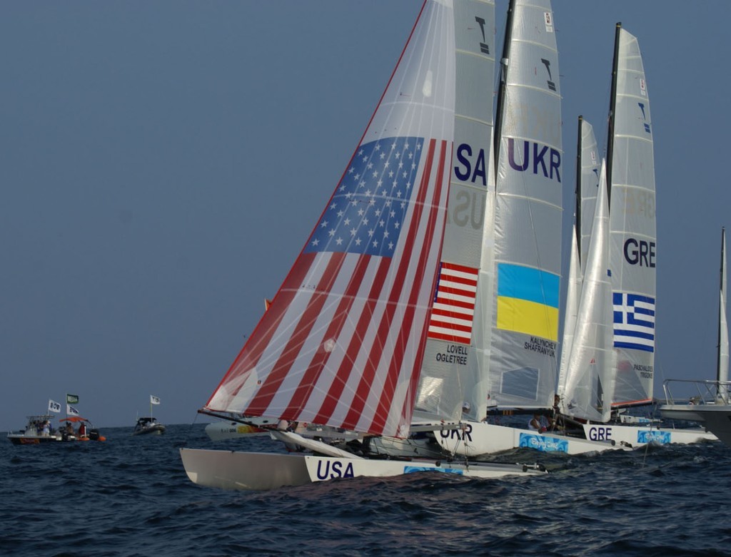 John Lovell and Charlie Ogletree make a good gain off the startline in the first race of the Tornado class at the 2008 Olympics with the upwind gennaker. photo copyright Richard Gladwell www.photosport.co.nz taken at  and featuring the  class