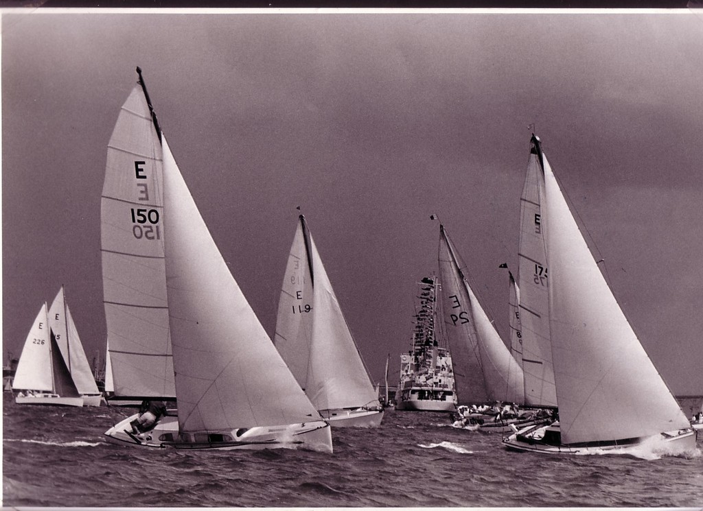 Nocturne (E150), the third Townson 26 or Serene class, racing in the Anniversary Regatta in the early ’60’s. Features included a fully battened heavily roached mainsail, long spinnaker pole, running backstays and dinghy like hull. © SW