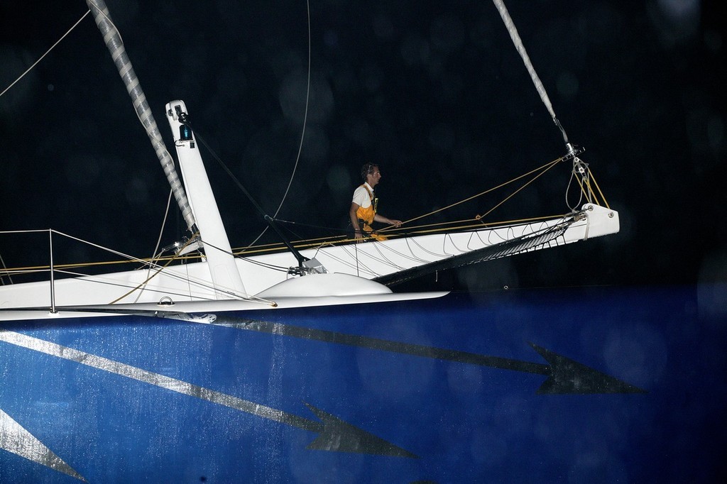 Big, blue, and fast.  Gitana 13 arrives in Hong Kong in a downpour. © Guy Nowell http://www.guynowell.com