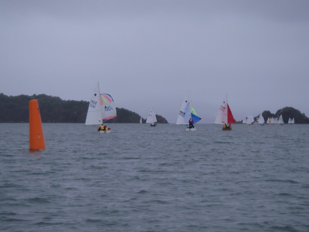 Sunbursts downwind towards Matiu and Mokpuna Islands, 2010 NZ Sunburst Nationals photo copyright Simon Miller taken at  and featuring the  class