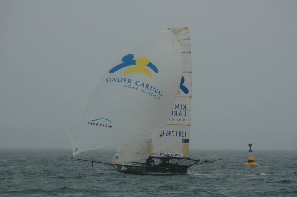 Two 18’ skiffs did the one lap dash part of the race, including Kinder Caring, seen here heading for the turn at Point Wolstoncraft.  © Blake Middleton