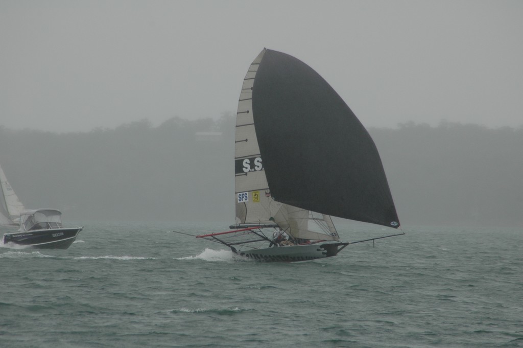 SailSkiff (with support boat in close pursuit during the entire 28 mile lap of the lake) roaring downwind from Mannering Park.  © Blake Middleton