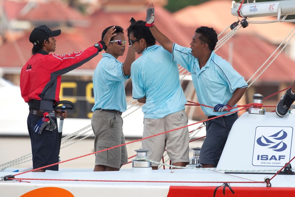Hazwan Hazim Dermawan (left) celebrate his victory over Marty Kaye at the Asian Match Racing Championships 2009 - Photo by Gareth Cooke photo copyright Gareth Cooke Subzero Images/Monsoon Cup http://www.monsooncup.com.my taken at  and featuring the  class