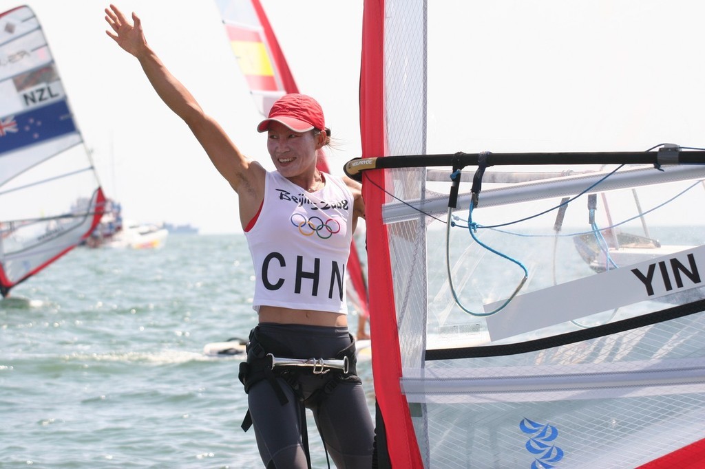 Jian Yin (CHN) celebrates immediately after crossing the finish line to win the RS:X Womens Gold medal © Richard Gladwell www.photosport.co.nz