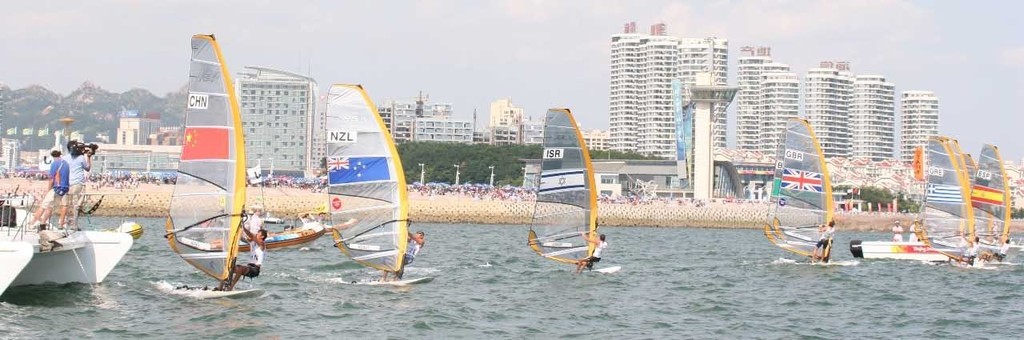 Ashley at the Committee Boat end of the start line while the bulk of his opposition are heading the other way on starboard at the start of the Medal race in the RS:X at Qingdao. photo copyright Richard Gladwell www.photosport.co.nz taken at  and featuring the  class