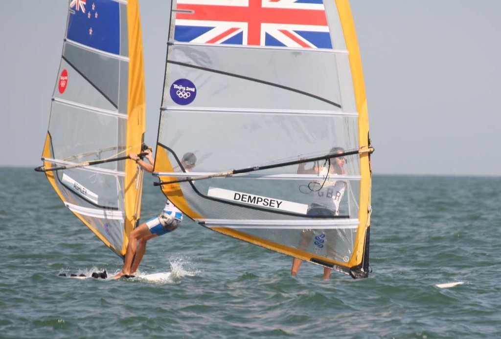 Ashley crosses ahead of Nick Dempsey (GBR) soon after the start of the Medal race in the RS:X at Qingdao. © Richard Gladwell www.photosport.co.nz