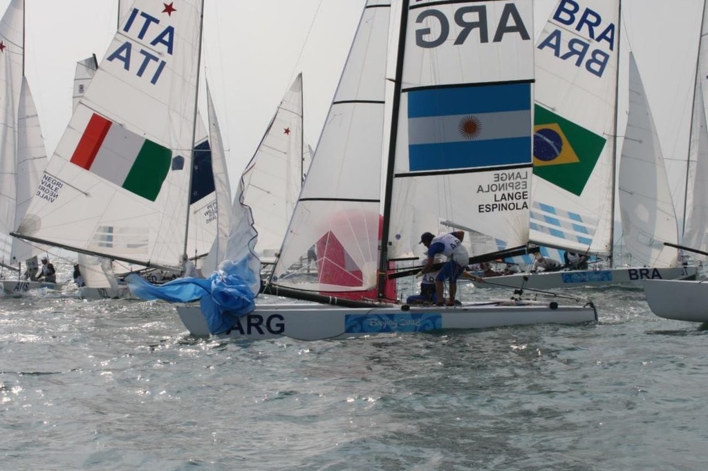 A Bugger’s Muddle as the Star and Tornado classes try to round the lewward mark together in the third race of the 2008 Olympic Regatta - Day 10. © Richard Gladwell www.photosport.co.nz