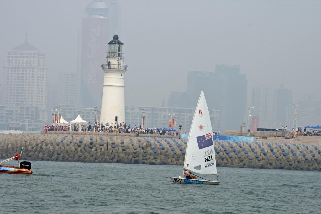 Andrew Murdoch (NZL) clears the end of the Olympic marina having taken the lead in the medal race - 2008 Olympics Qingdao © Richard Gladwell www.photosport.co.nz