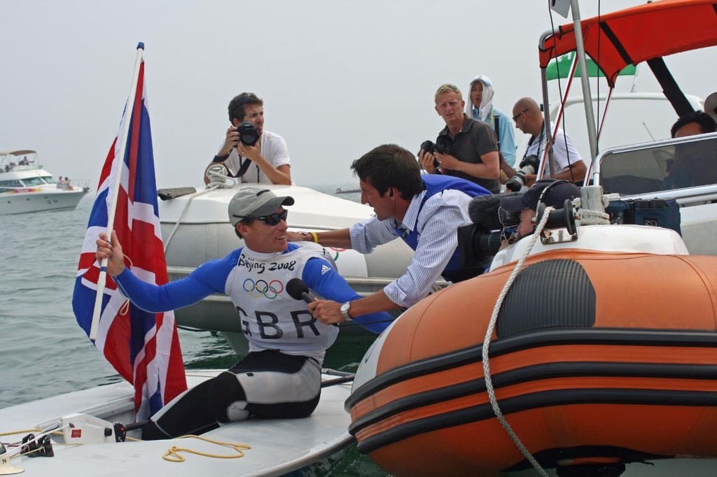 Paul Goodison (GBR) winner of the Gold Medal Mens Laser class is interviewed by TV - 2008 Olympics &copy; Richard Gladwell www.photosport.co.nz