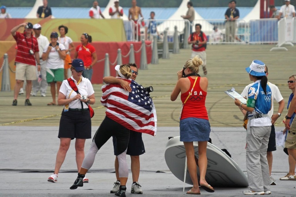 Anna Tunnicliffe (USA) winner of the Gold Medal, celebrates ashore in Qingdao Olympic Harbour. © Richard Gladwell www.photosport.co.nz