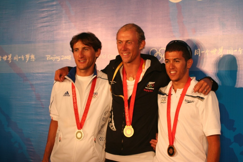 Winners are grinners - Julien Bontemps (FRA) Silver medallist; Tom Ashley NZL Gold medallist; Shahar Zubari (ISR) Bronze medallist  - Qingdao RS:X Mens event. photo copyright Richard Gladwell www.photosport.co.nz taken at  and featuring the  class