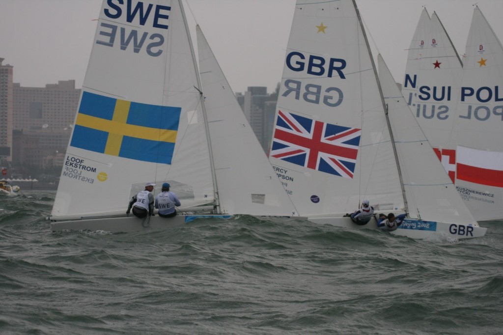 Iain Percy and Andrew Simpson start in the Medal race of the Star class in the 2008 Olympics, coming from behind to win the Gold Medal in the final race, sailed in strong winds and big seas. photo copyright Richard Gladwell www.photosport.co.nz taken at  and featuring the  class