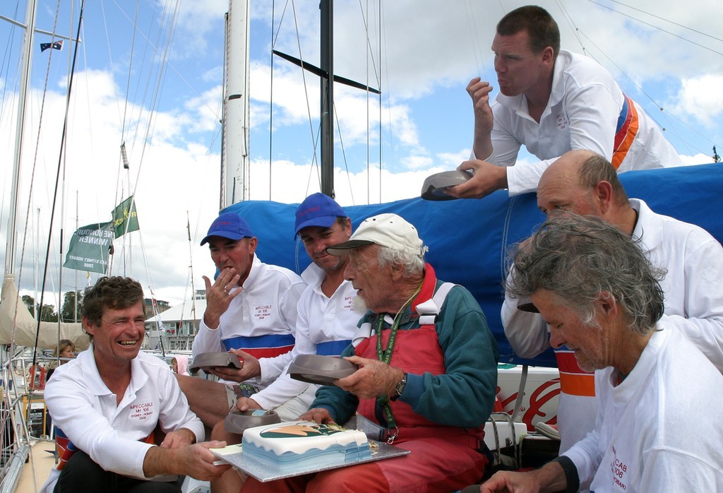John Walker dishing out the cake in the boats dog bowls - Rolex Sydney Hobart Yacht Race 2008 © Crosbie Lorimer http://www.crosbielorimer.com