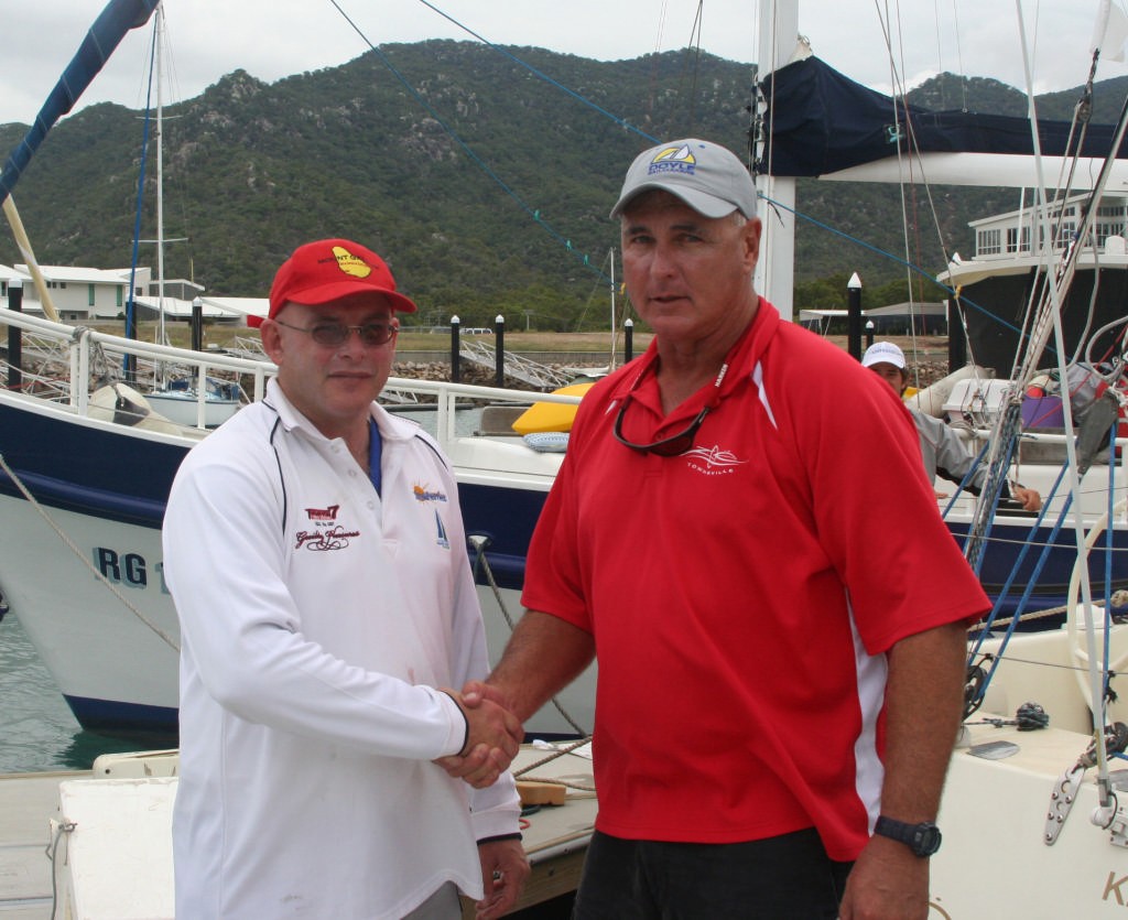 Leon Thomas (l)Guilty Pleasures shakes the hand of the winner Wayne Millar (r) Zoe. Magnetic Island Race Week Day 4 photo copyright Sail-World.com /AUS http://www.sail-world.com taken at  and featuring the  class