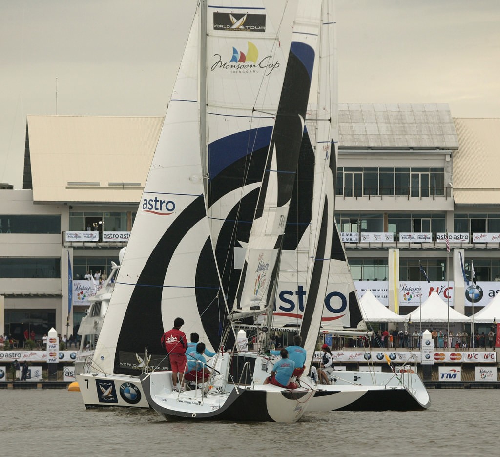 Racing in front of the grandstand buildings (Koo vs Tan) photo copyright Guy Nowell http://www.guynowell.com taken at  and featuring the  class