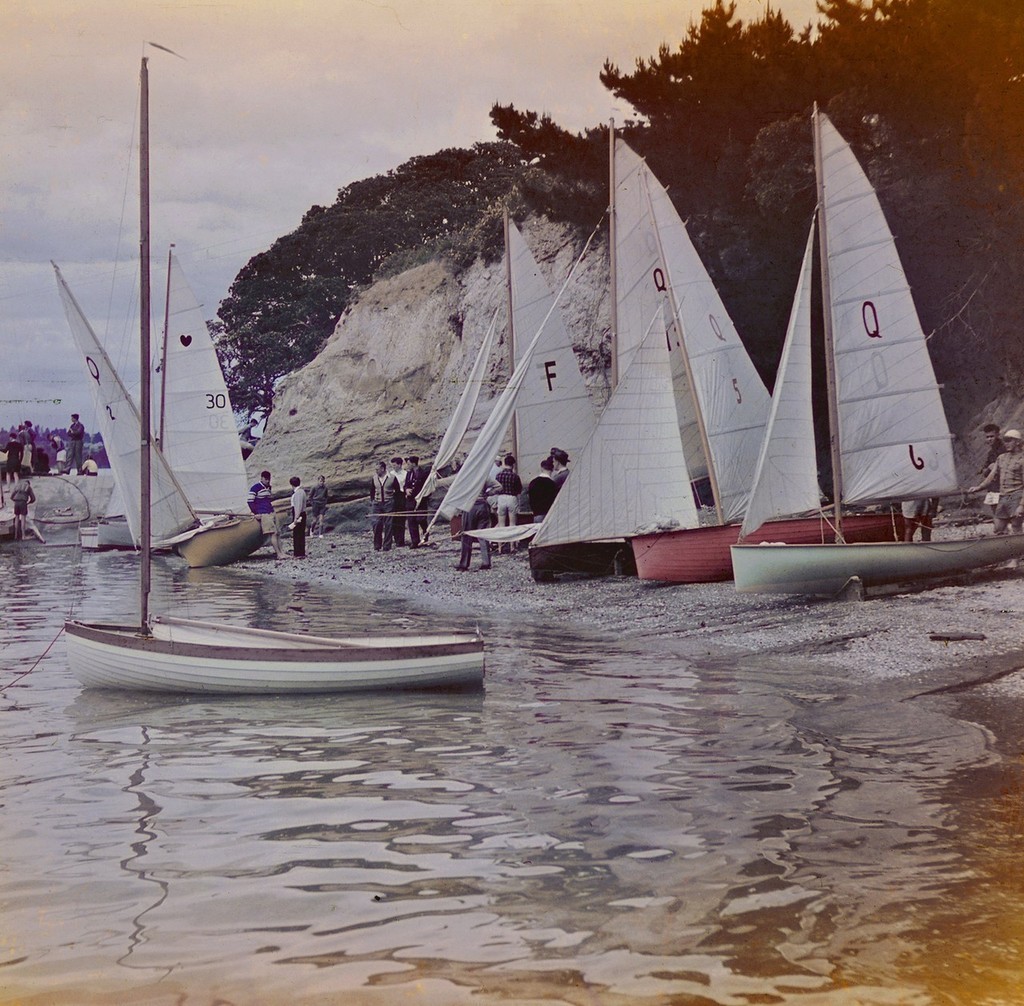A mix of 12ft skiffs (``Q`` class) Cherubs and a Frostbite at Glendowie Boating Club.Q 2 at the waters edge is Ada, F is Futile, Q 13 is Echo, Q5 Red Riding Hood and Q 6 is Mercury which was designed by Des as a Pennant, but re registered as a Q. 
 photo copyright Townson Family taken at  and featuring the  class
