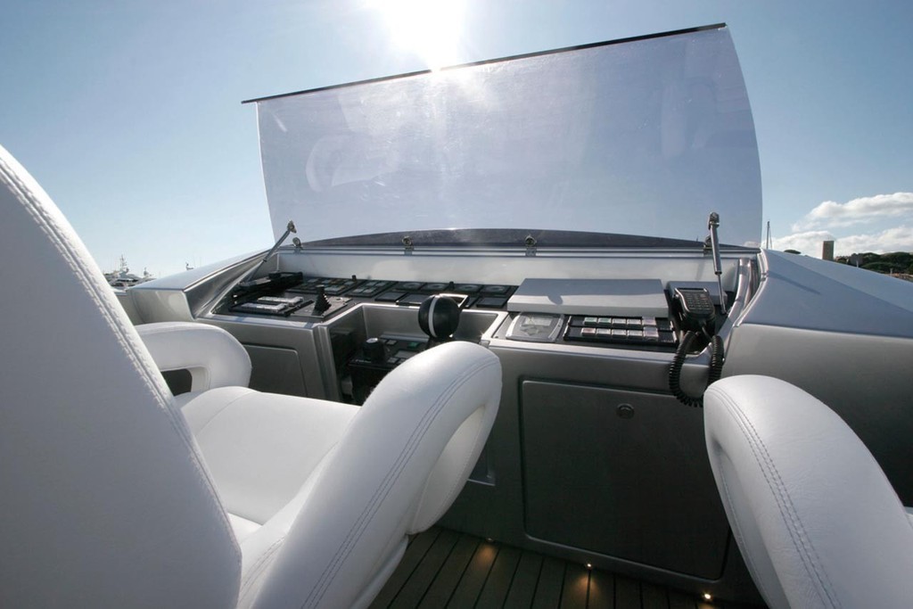The flybridge helm on the 115 feature highly reclined leather helm chairs and a perspex instrument protector elevates to become a 50 knot windshield © Ocean Magazine http://www.oceanmagazine.com.au/