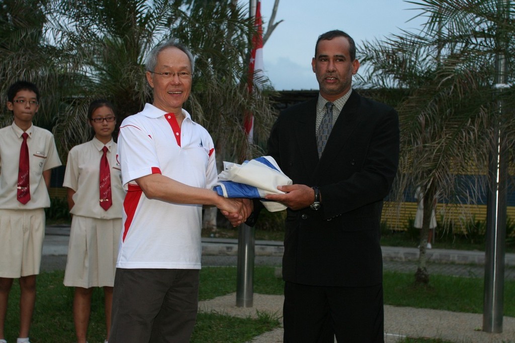 Mr Talib Al Murri, Vice President of Qatar Sailing and Rowing Federation (right) receiving the IODA flag from Mr Peter Lim, Honorary Advisor of SingaporeSailing photo copyright SingaporeSailing taken at  and featuring the  class