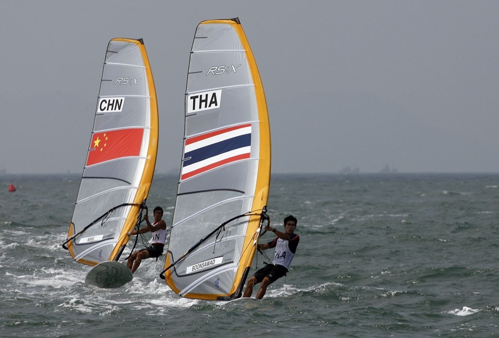 Qingdao Olympic Regatta 2008. RS:X. Ek Boonsawad (THA), Wang Aichen (CHN). © Guy Nowell http://www.guynowell.com