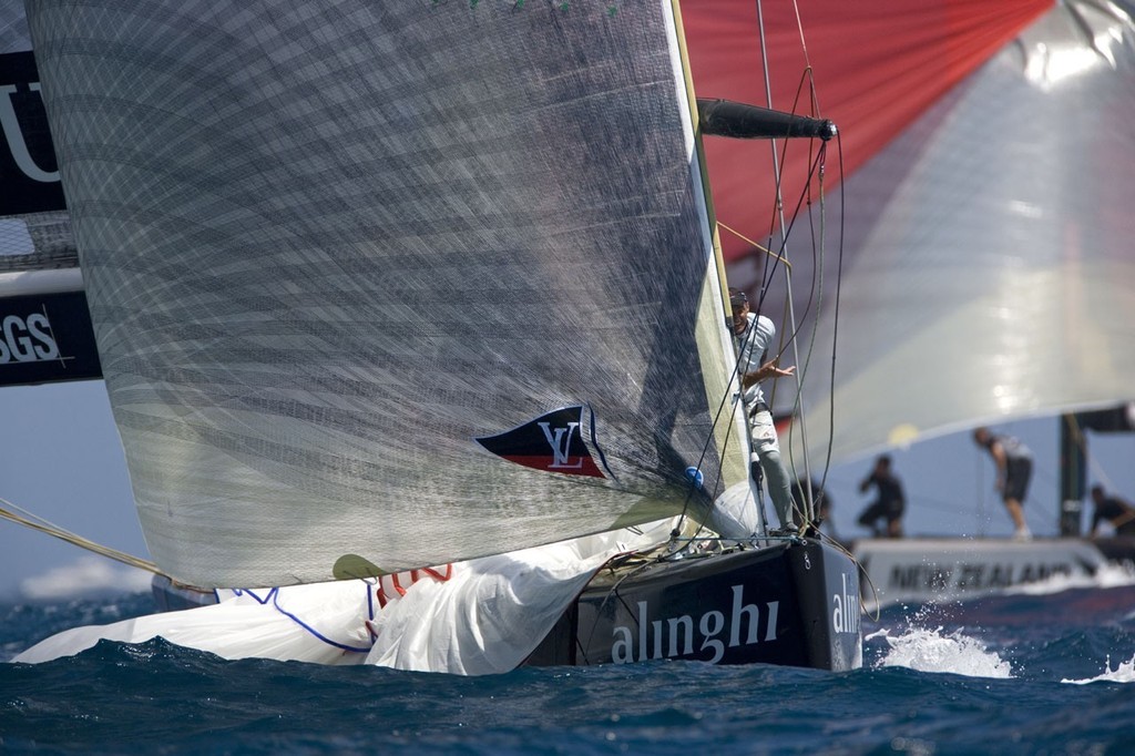 SUI100 leading NZL92 at downwind mark. Bowman Pieter van Nieuwenhuyzen (NED) on foredeck , spinnaker going down and boat turning the mark in few second.


 photo copyright Thierry Martinez/Alinghi - Copyright taken at  and featuring the  class